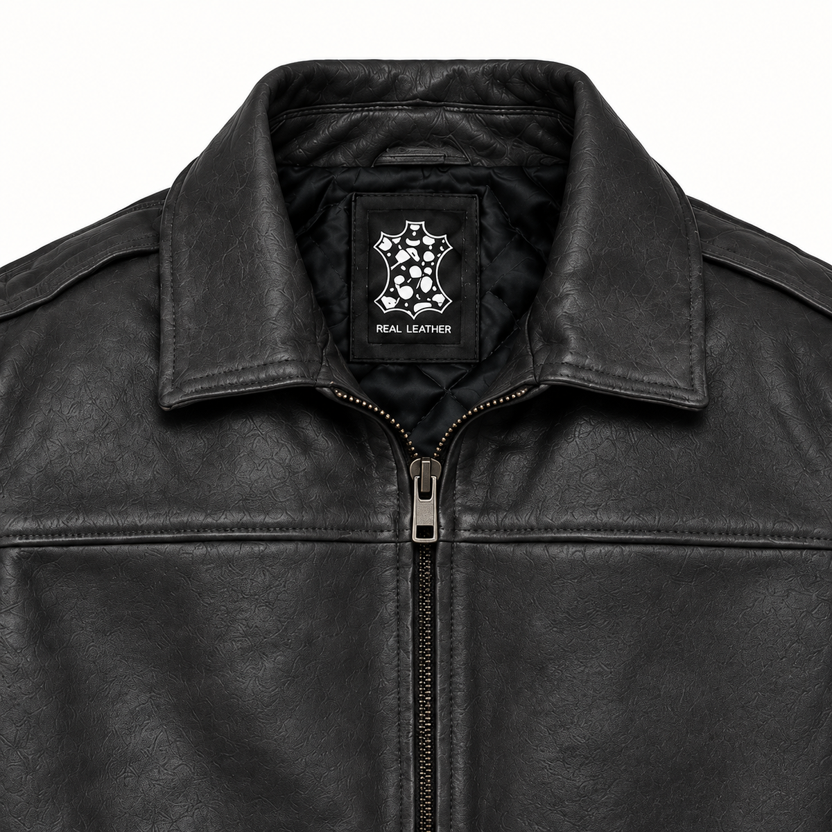 Close-up of the black leather bomber jacket collar, upper chest and stitching details.
