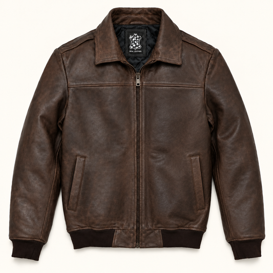 Three-quarter front view of a distressed brown leather bomber jacket worn open to show the dark quilted lining.
