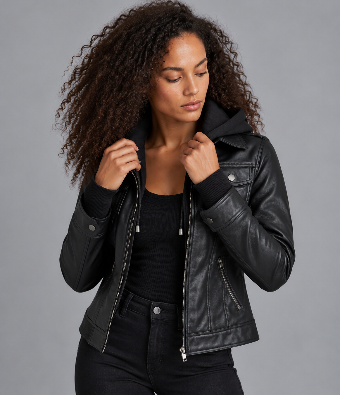 Removable hood detail on womens black leather jacket closeup 